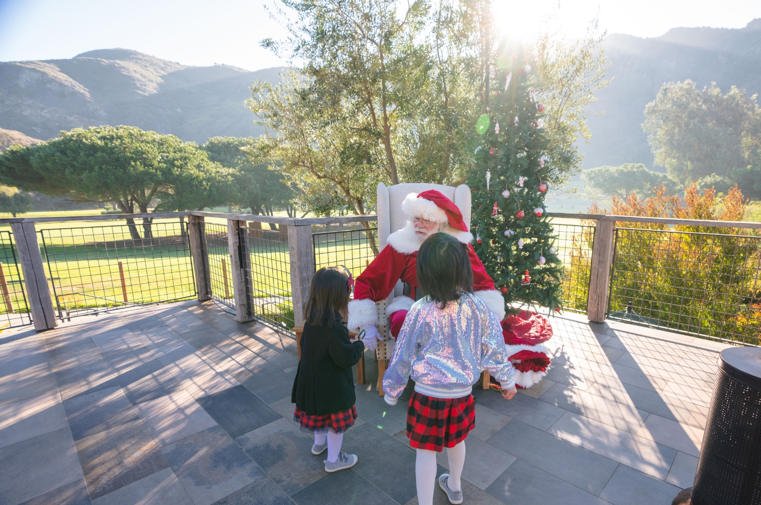 Two children meeting Santa Claus in Aliso Canyon