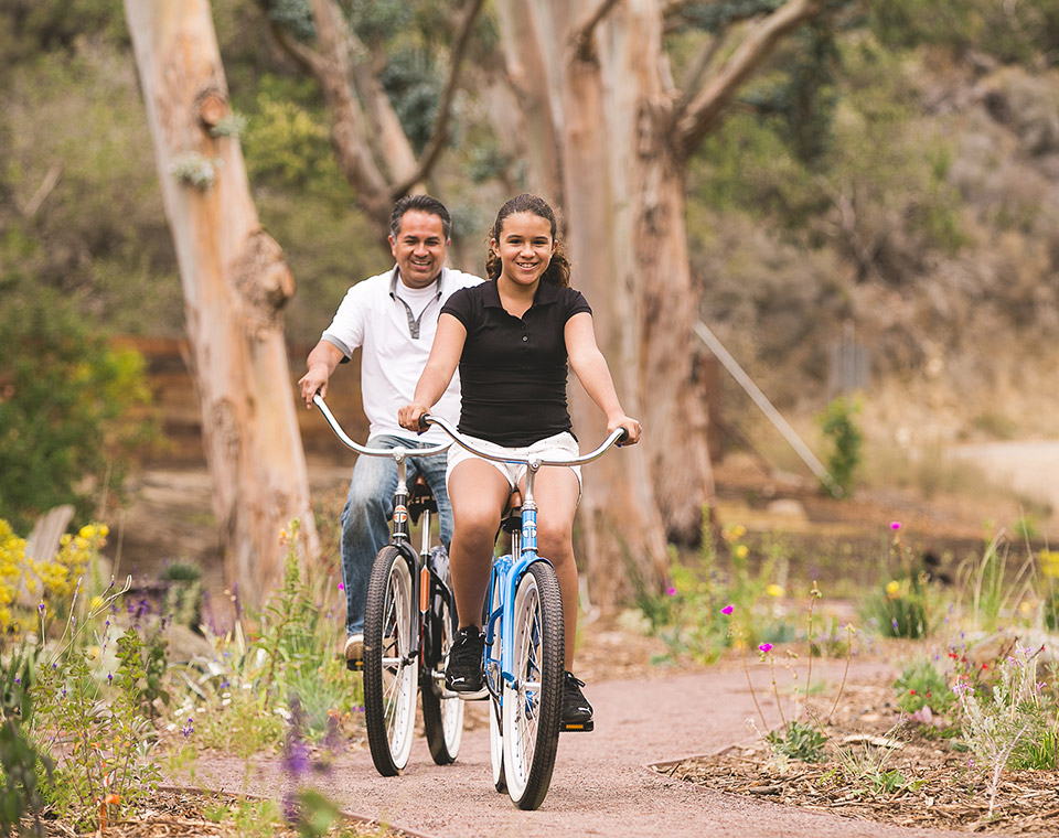 Father and Daughter riding their bikes