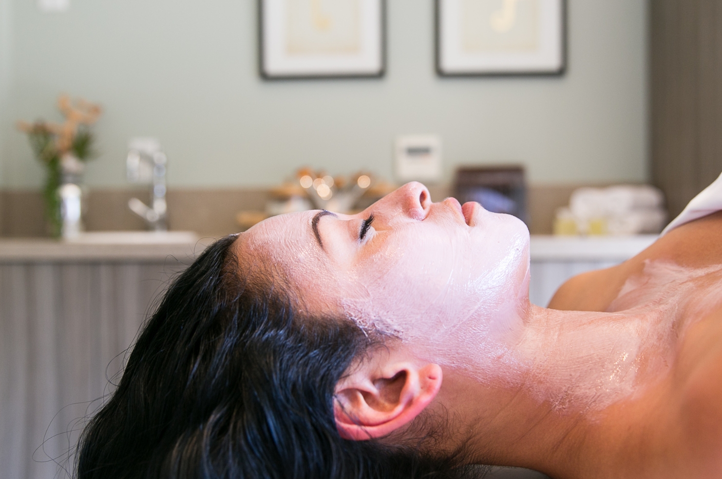 Guest at the spa receiving a facial treatment